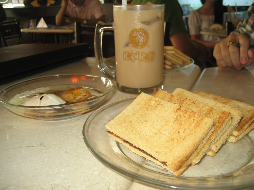 Iced tea with milk, soft boiled eggs and kaya toast